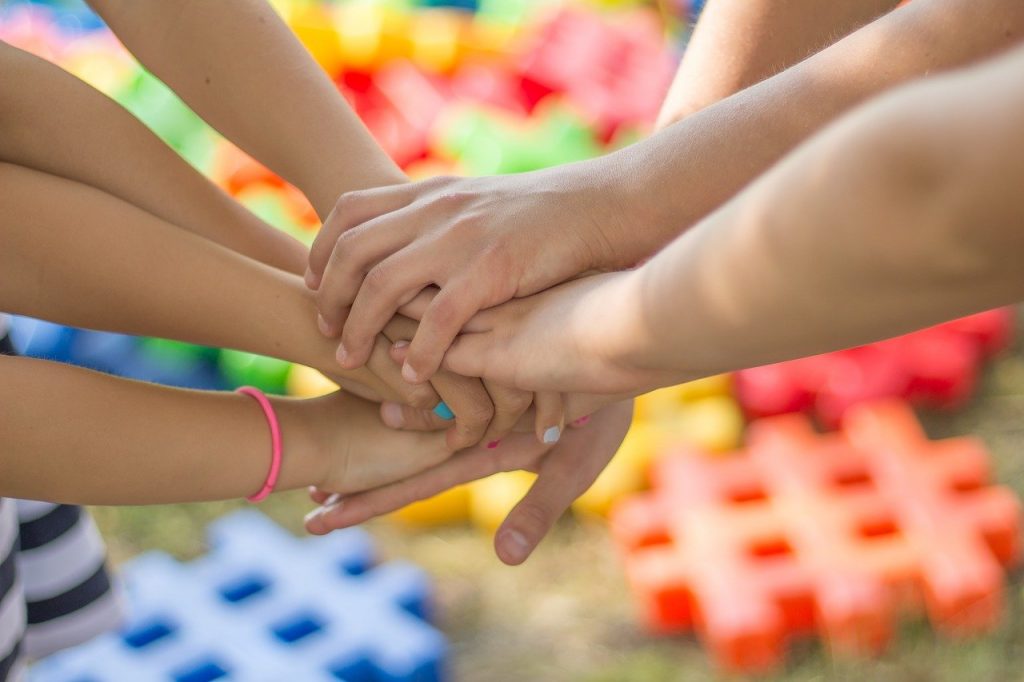 Happy hands joined together.